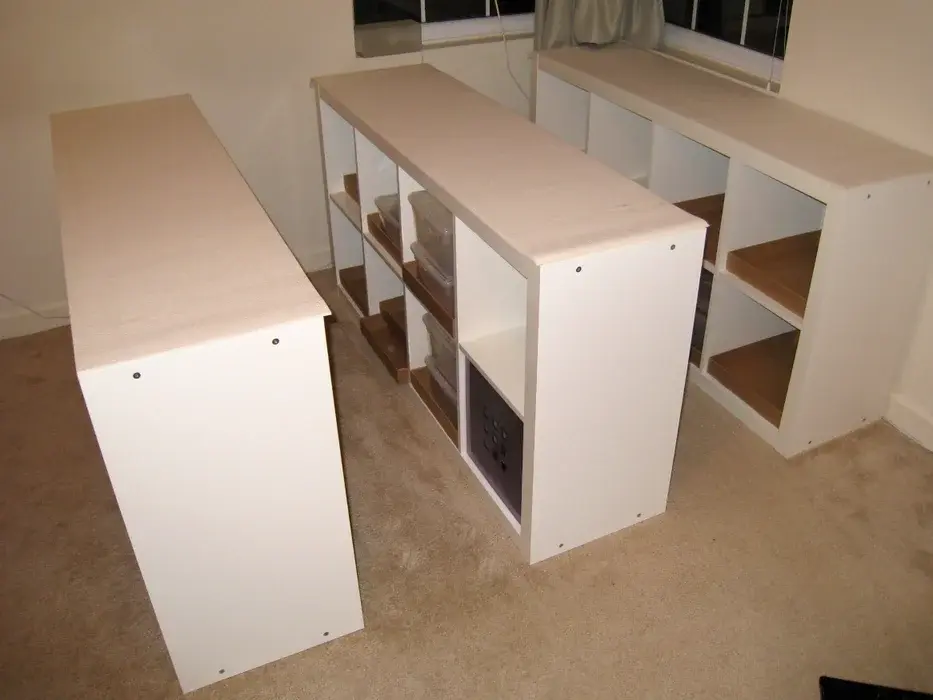 </p><p>Build the Expedit Bookshelves Follow Ikea's instructions to assemble the Expedit Bookshelves. Place them evenly spaced on the floor.</p><p>Step 2: Attach Cross Braces Attach the Ikea Observator 39