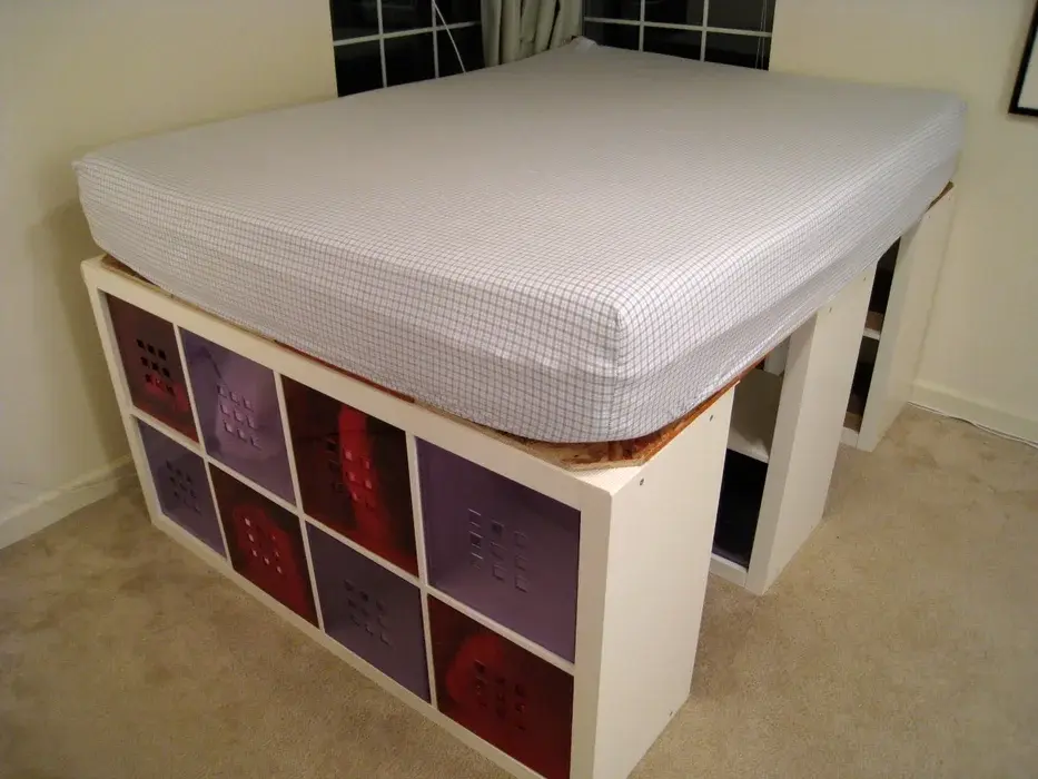 </p></div><p>I made under-bed storage using Ikea Expedit Bookshelves. It's a simple project that doesn't require cutting anything, and surprisingly, the bed is sturdy. Since I already had a bed and frame, it cost me about $400.</p><p><strong>Here's what you'll need:</strong></p><ul><li>3 Ikea Expedit Bookshelves ($90 each)</li><li>2 Ikea Observator Cross Braces 393 Version ($5 each) - Make sure to get the 39